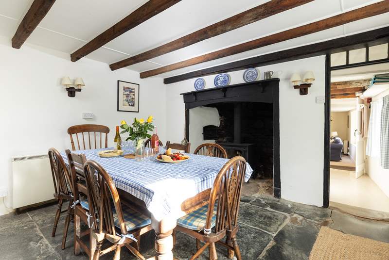 A traditional dining-table in a traditional setting with a gorgeous inglenook fire!