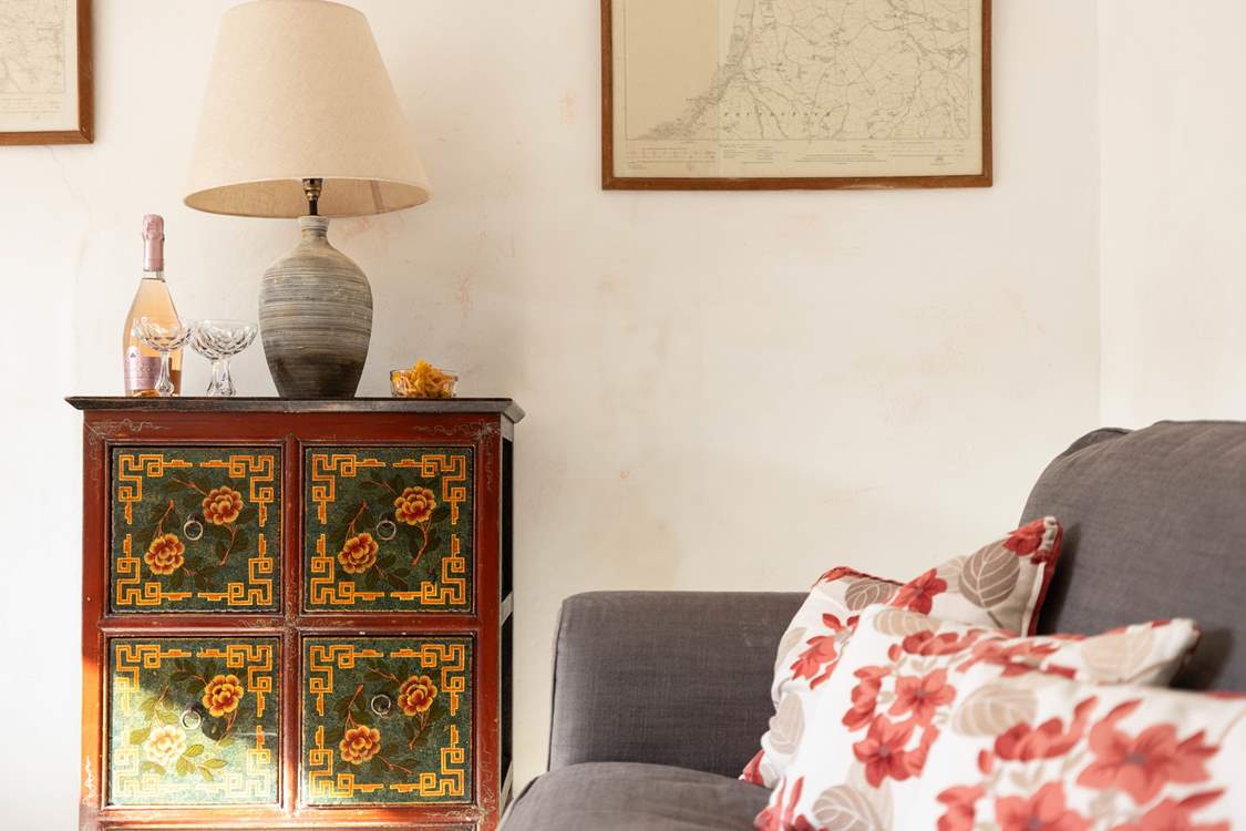 The snug is quaint and simple offering a perfect breakout room for old and young with views out across the garden.