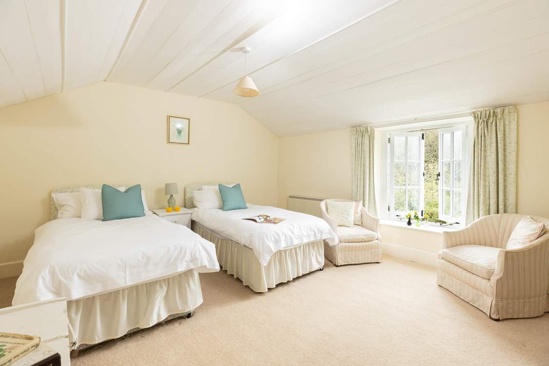 Head up the stairs from the sitting-room to bedroom one, traditionally styled in muted tones creating the perfect twin.