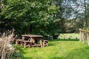 Enjoy breakfast al fresco surrounded by the pretty woodland.