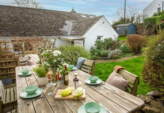 Take four steps up to the outside seating area which overlooks the garden. 
