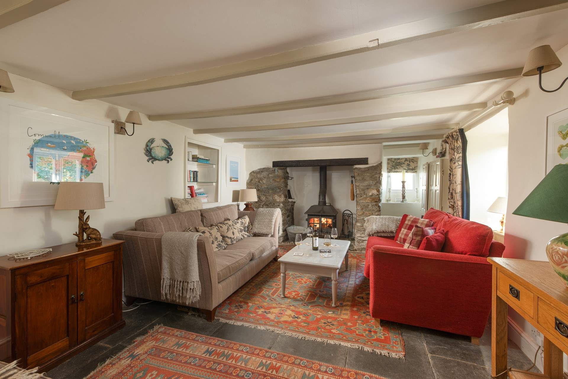 The cosy sitting-room with a toasty wood-burner. 