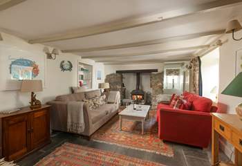 The cosy sitting-room with a toasty wood-burner. 