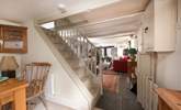 The steep open stairs lead to three bedrooms and family bathroom. - Thumbnail Image