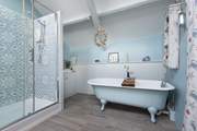 The family bathroom is on the first floor. Here you will find a rather fabulous roll-top bath and large shower.