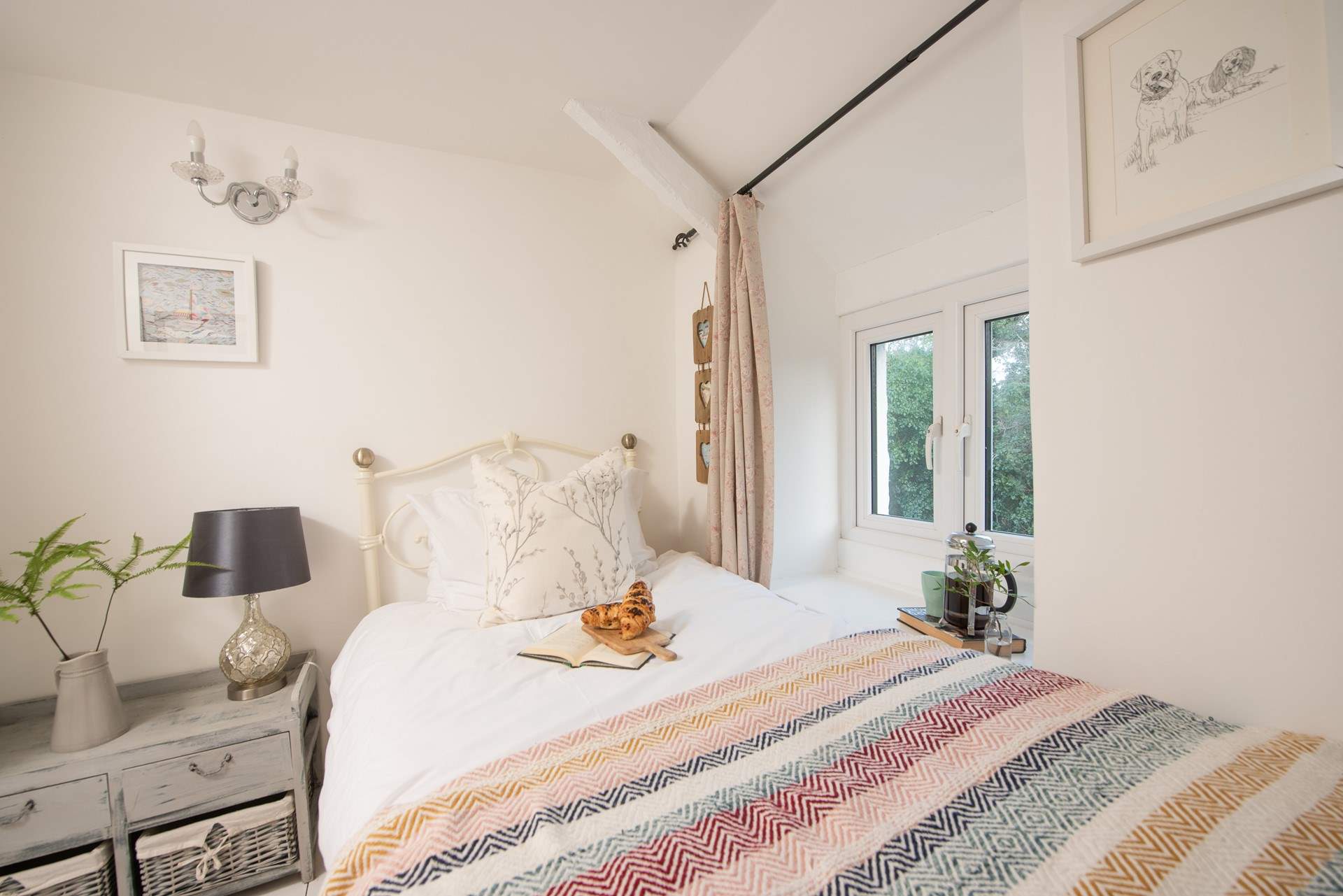 The sweet single bedroom is located on the first floor.