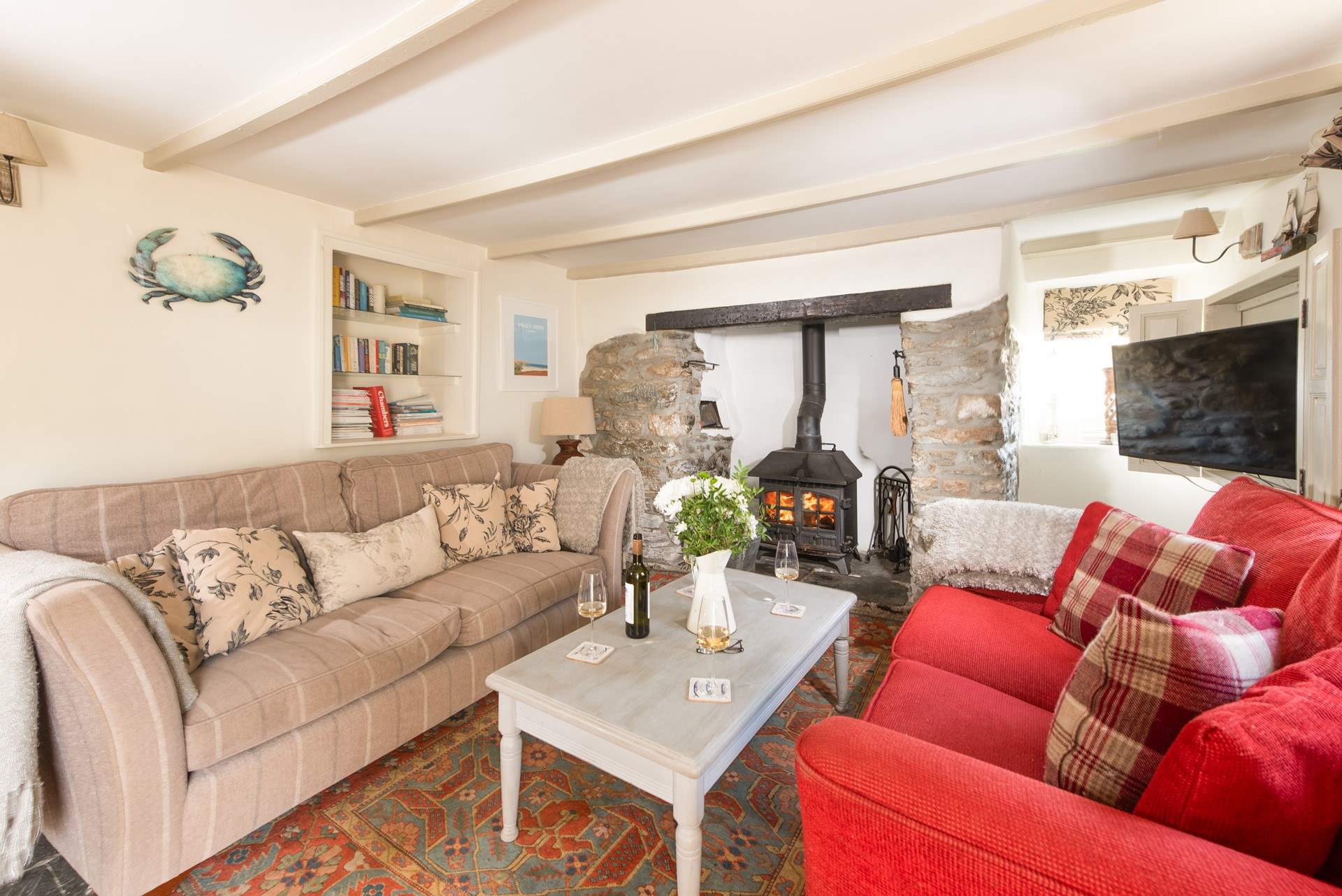 The very pleasant sitting-room where you can snuggle up on one of the  sofas and catch a film on the TV.