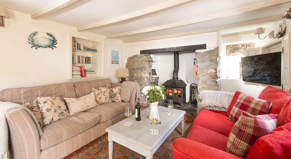 The very pleasant sitting-room where you can snuggle up on one of the  sofas and catch a film on the TV.