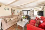 The very pleasant sitting-room where you can snuggle up on one of the  sofas and catch a film on the TV.