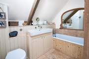 Enjoy a hot bubble bath after a beach day in the en suite bathroom.