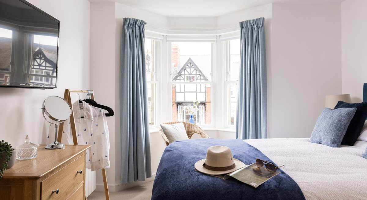 Relax and recline in this pretty bedroom.