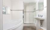 This is the spacious en suite to bedroom 3, complete with a separate bath and a glow mirror. - Thumbnail Image