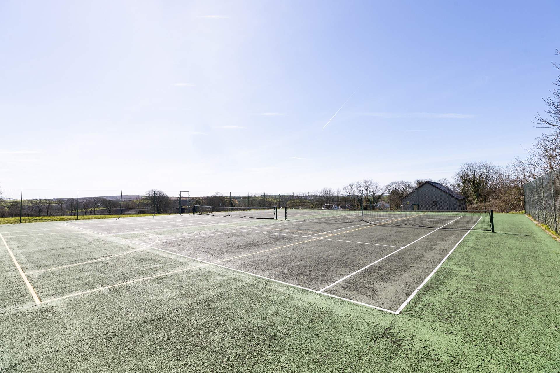 The tennis courts at Manaccan have an honesty box for your use. There is also a playing field and park here, with free parking.