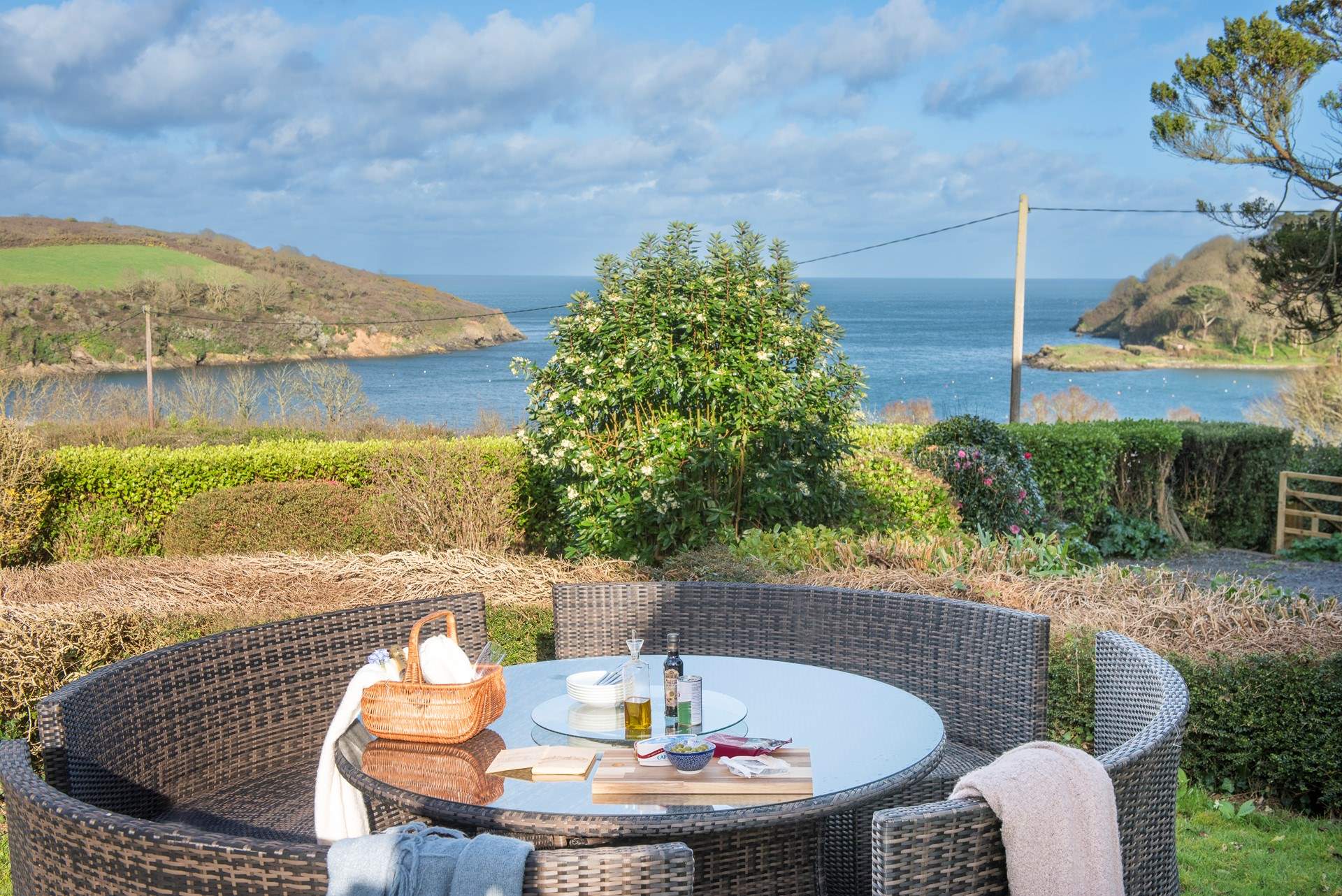 The second outdoor seating area is perfect for social evenings, complimented by the magnificent backdrop.