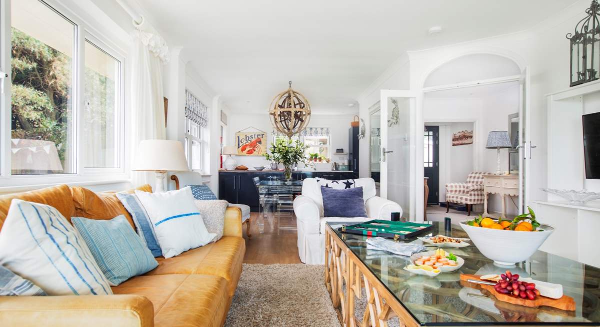 The open plan living-room looking towards the dining-area and kitchen, a great space to all be together.