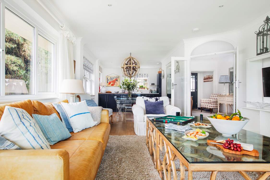 The open plan living-room looking towards the dining-area and kitchen, a great space to all be together.