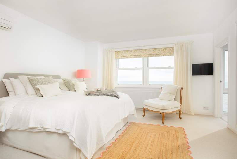 The main bedroom with super-king double bed and gorgeous sea views.
