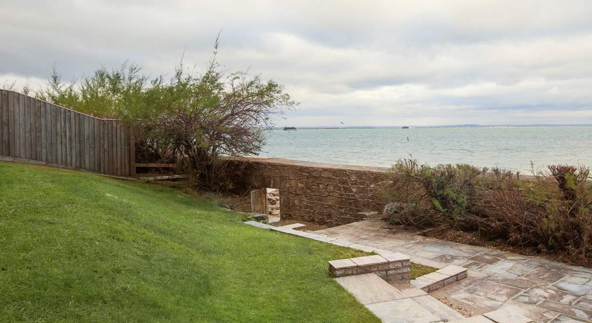 The stunning view of the Solent from the garden, with beach access below.