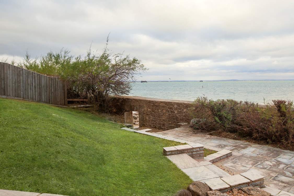 The stunning view of the Solent from the garden, with beach access below.