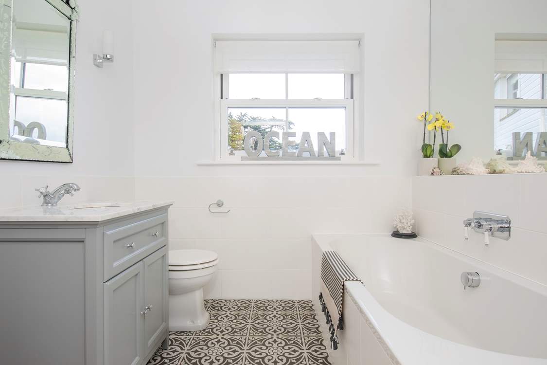The bathroom with luxurious bath on the ground floor.