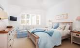 Charming bedroom 4 with a double bed and TV and views towards the garden and sea.  A little sanctuary. - Thumbnail Image