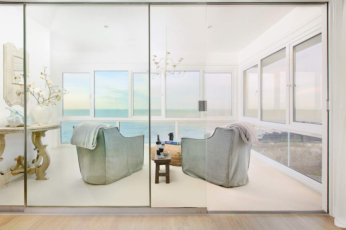 The sun-room off the living area is the perfect spot to reflect and take in the views. Pull the doors across for that added quiet space.