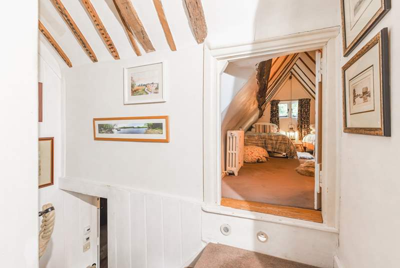 The twin room is accessed off the landing at the top of the stairs through this cute and unusual door  - ideal for children or adults happy to step into a fairy-tale room. 
