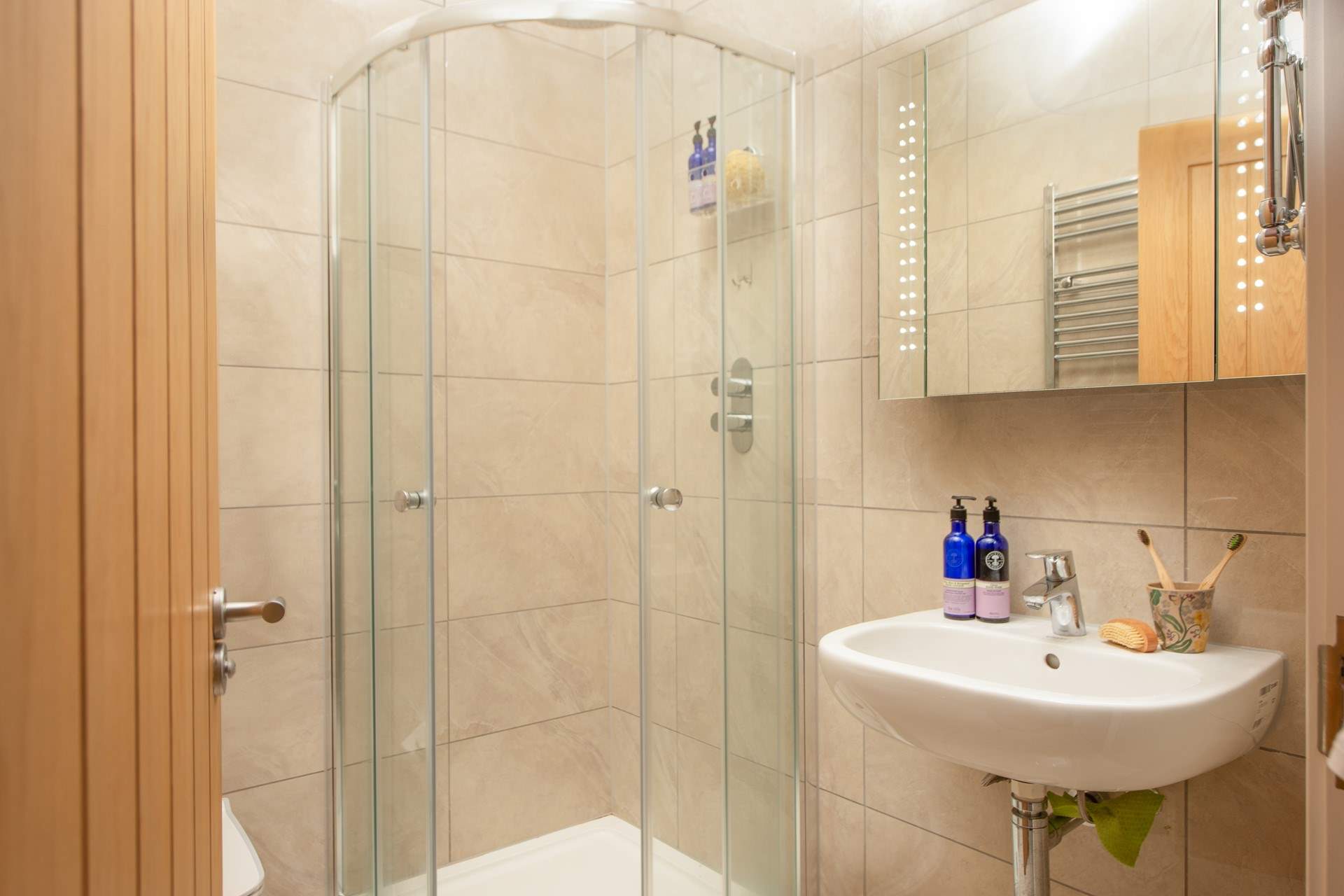 Bedroom one has an en suite shower-room, ideal for a quick rinse off after a day on the beach.