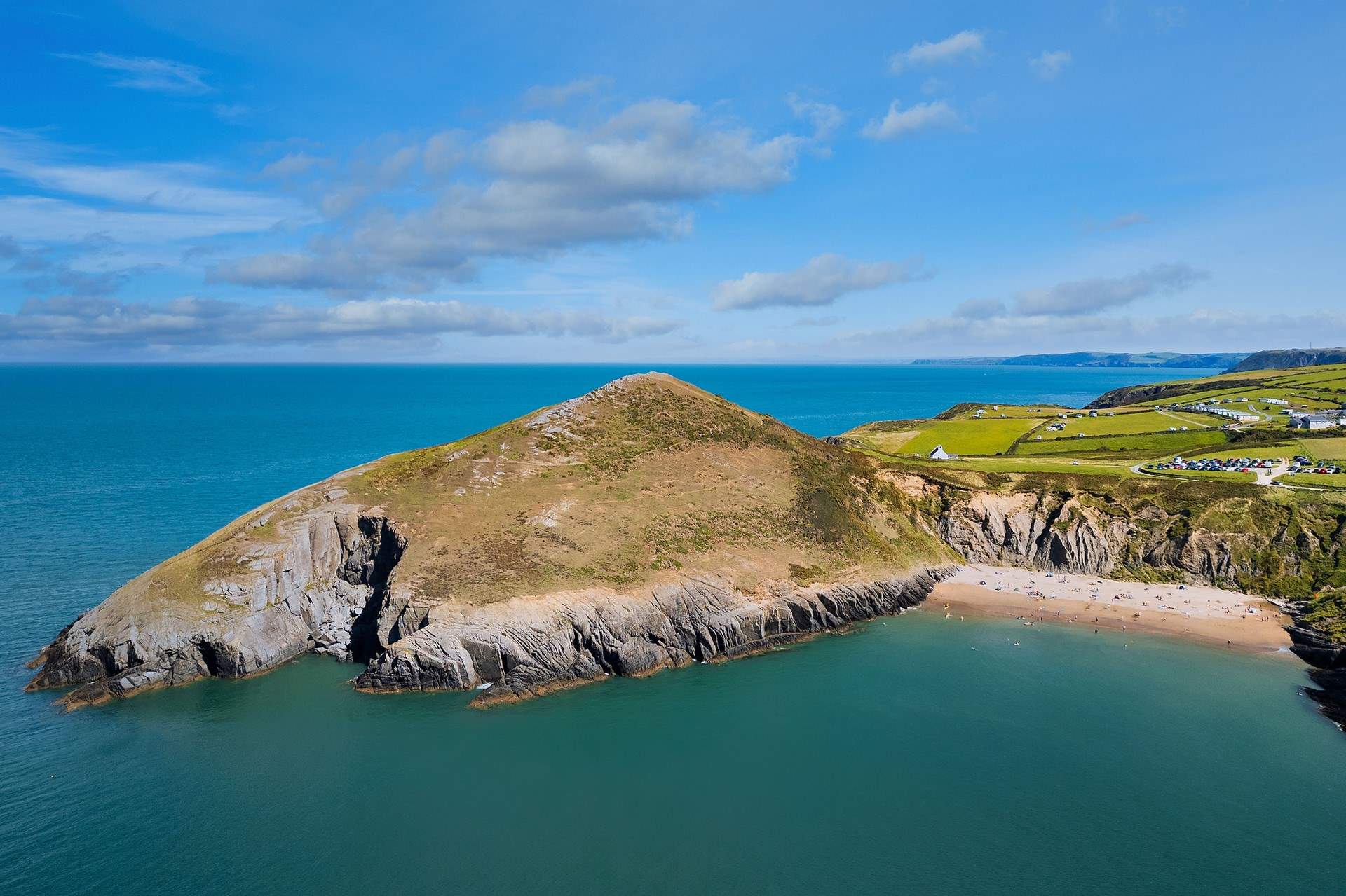 Spot dolphins in the bay from heavenly Mwnt Beach. 