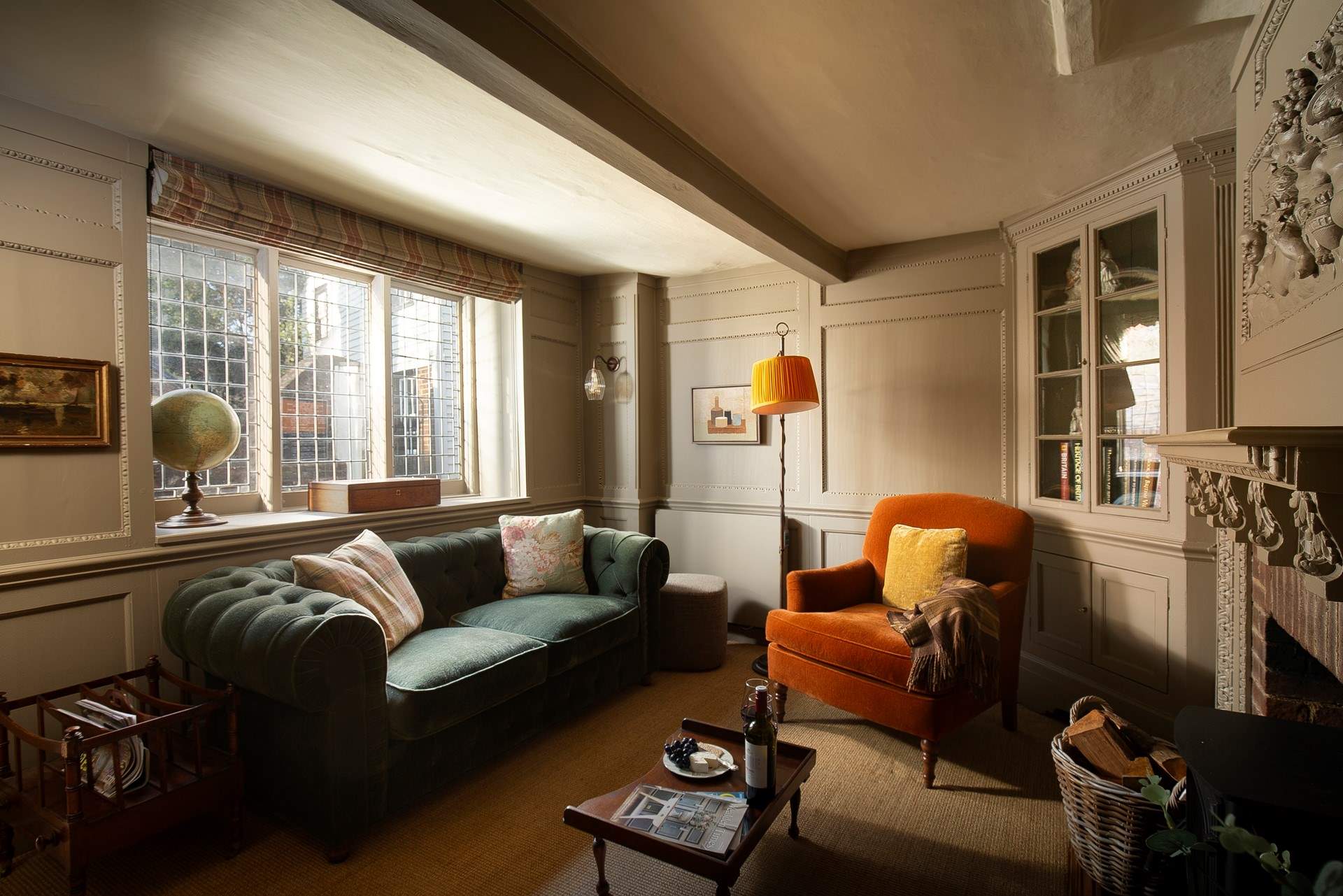 Sumptuous furnishings and a view through a leaded window to St Mary's Church.
 