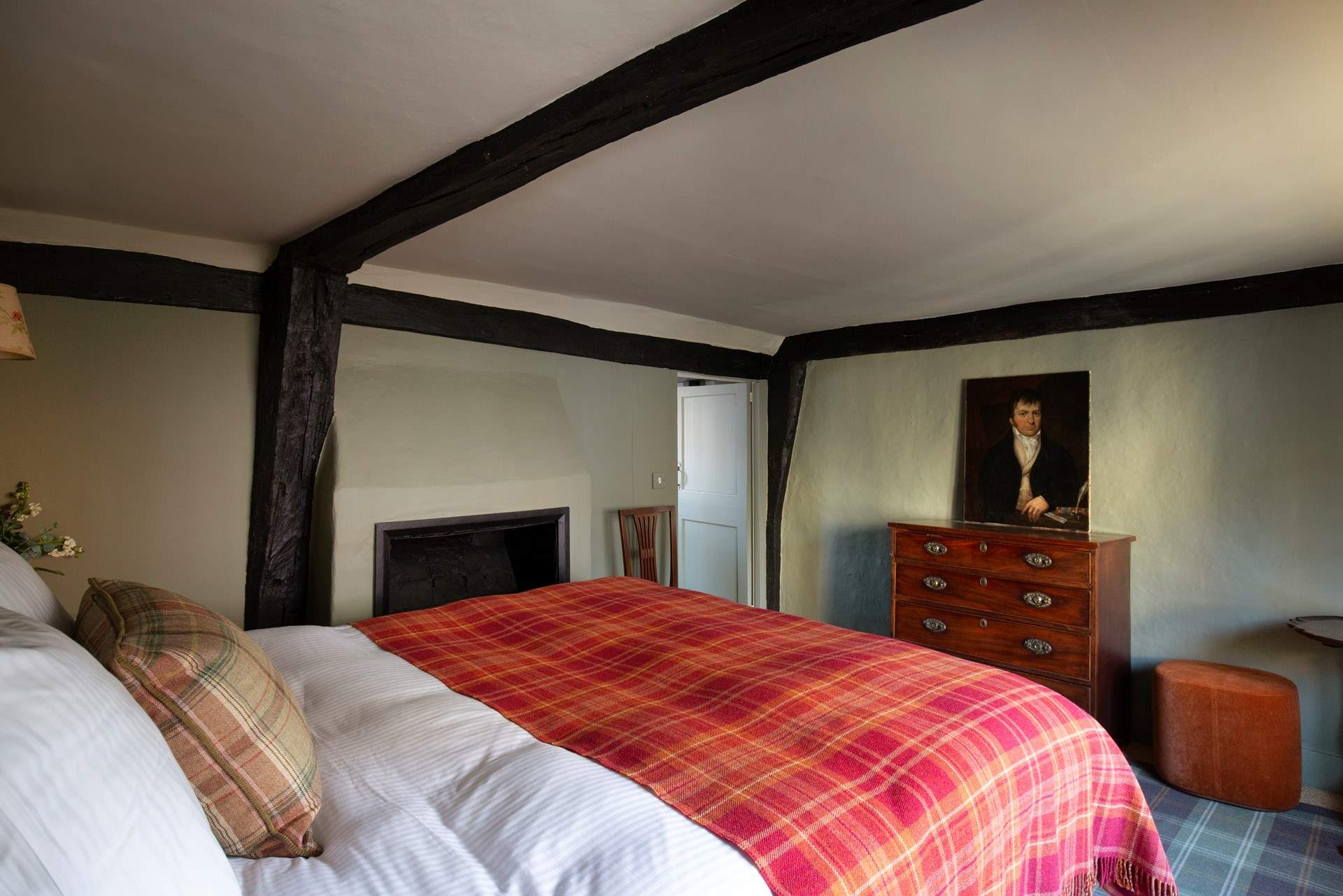 The bedroom with feature fireplace.