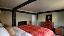 The bedroom with feature fireplace.
