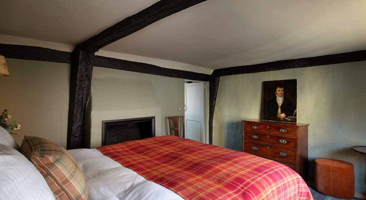 The bedroom with feature fireplace.