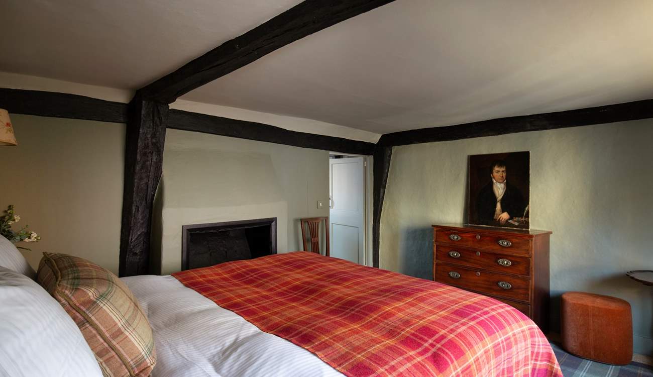 The bedroom with feature fireplace.