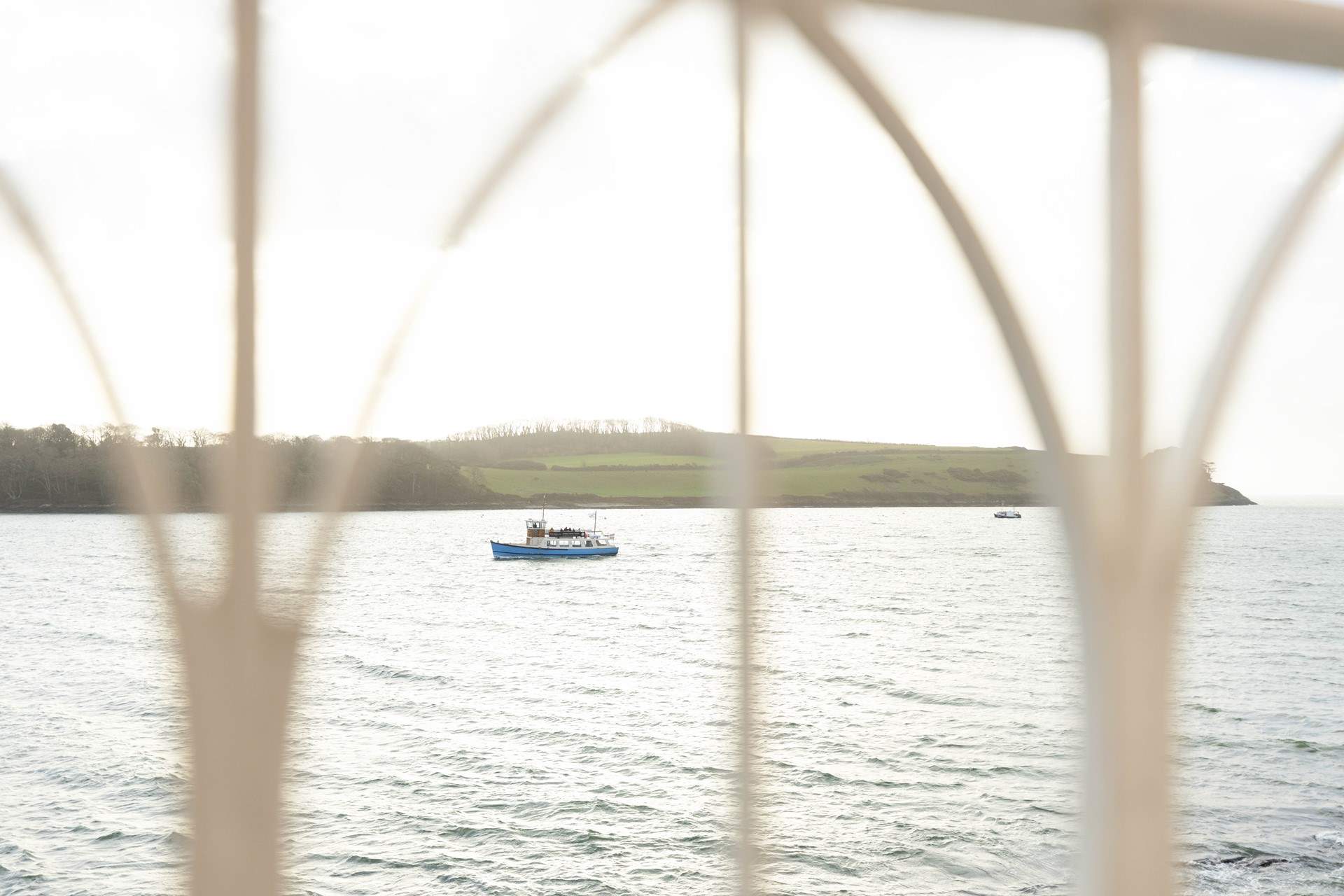 Watch the boats sail past. 