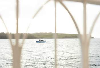 Watch the boats sail past. 