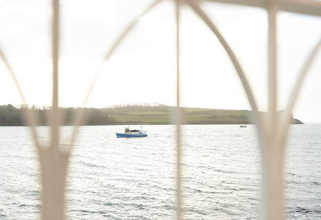 Watch the boats sail past. 