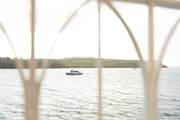 Watch the boats sail past.