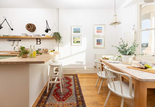 The kitchen/dining-room is beautifully styled. 