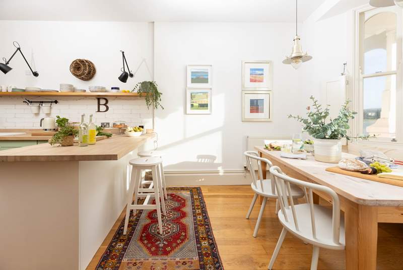 The kitchen/dining-room is beautifully styled. 