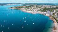 A bird's eye view of St Mawes with Falmouth in the background.