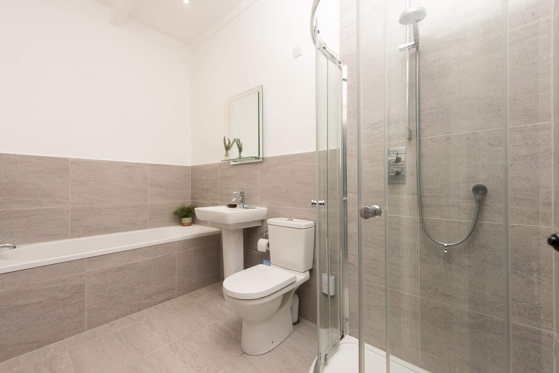 The en suite bathroom has a separate shower cubicle.