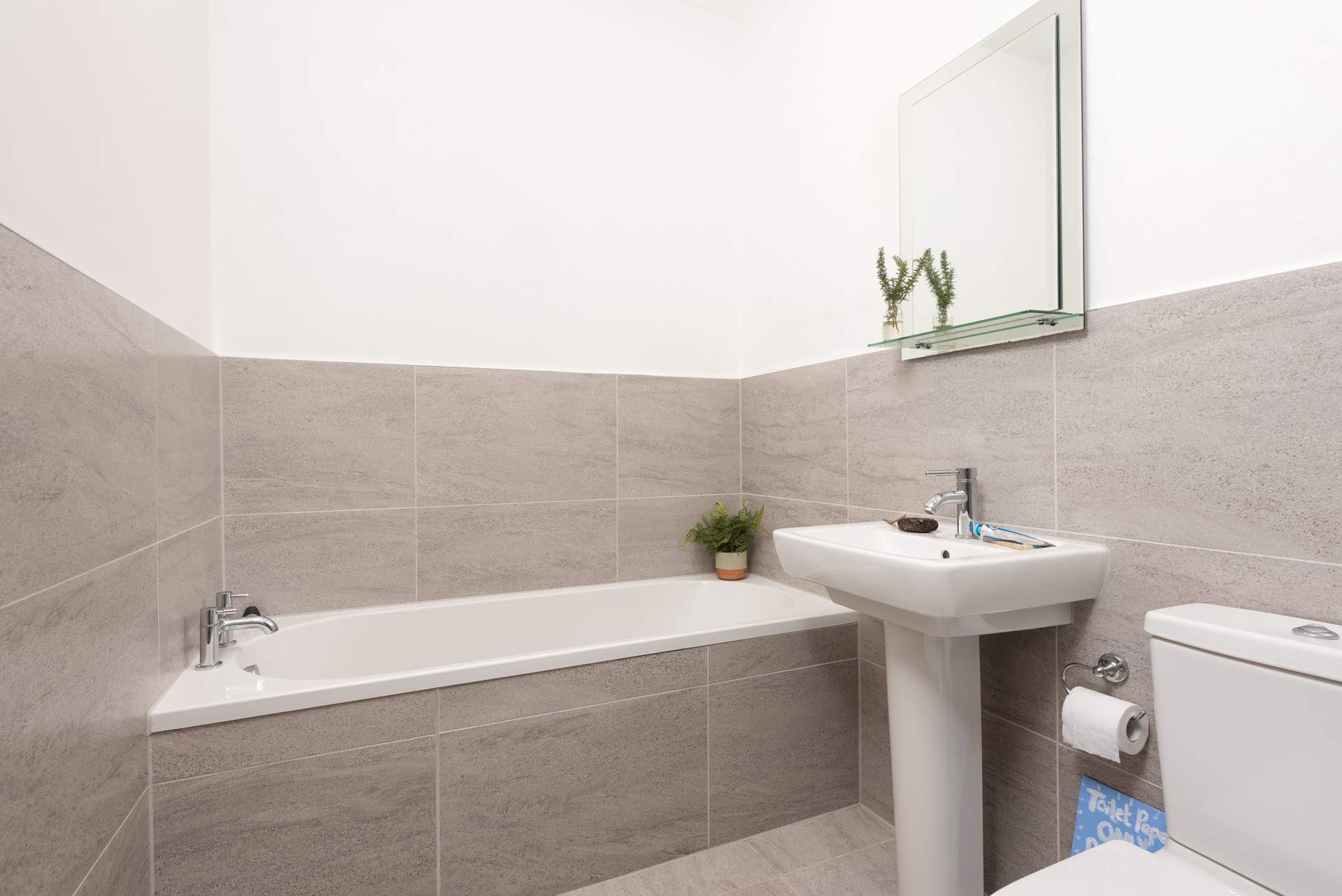 The ensuite features a bath.