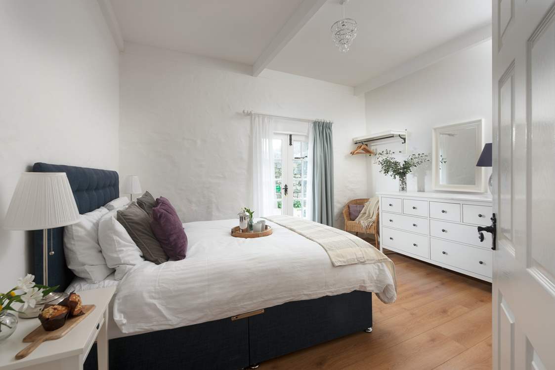The king bedroom is really spacious with beautiful beams.