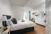 The king bedroom is really spacious with beautiful beams.