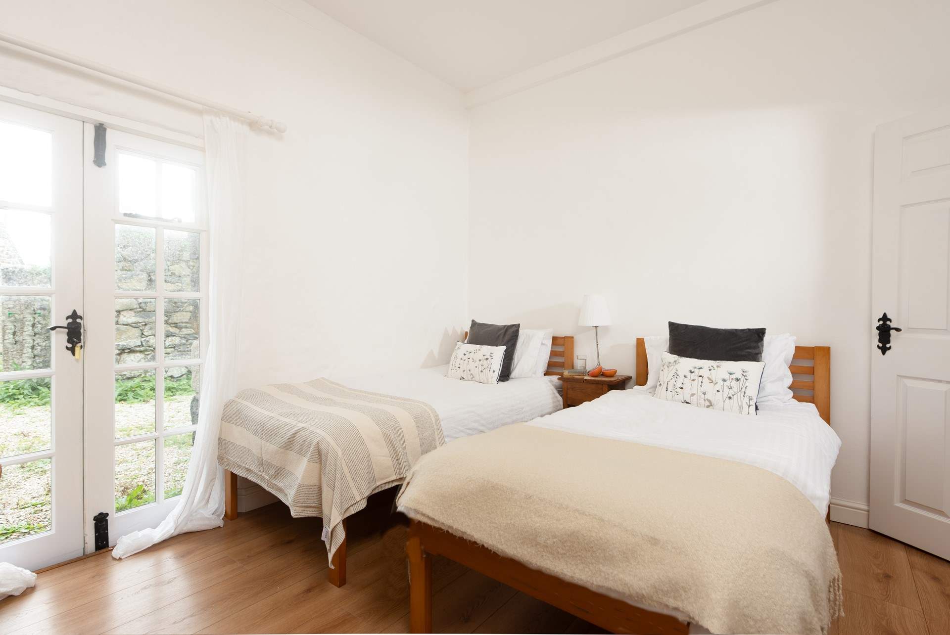 The second bedroom is a lovely twin.