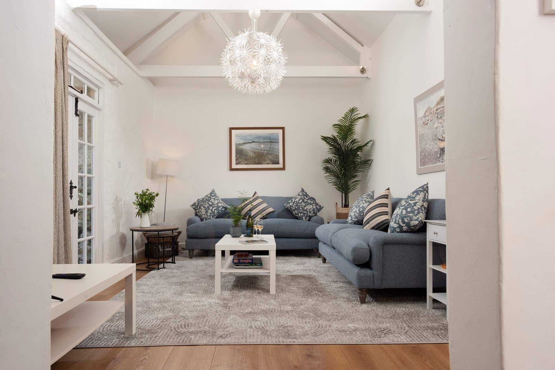 The sitting room boasts local art and chic interiors.