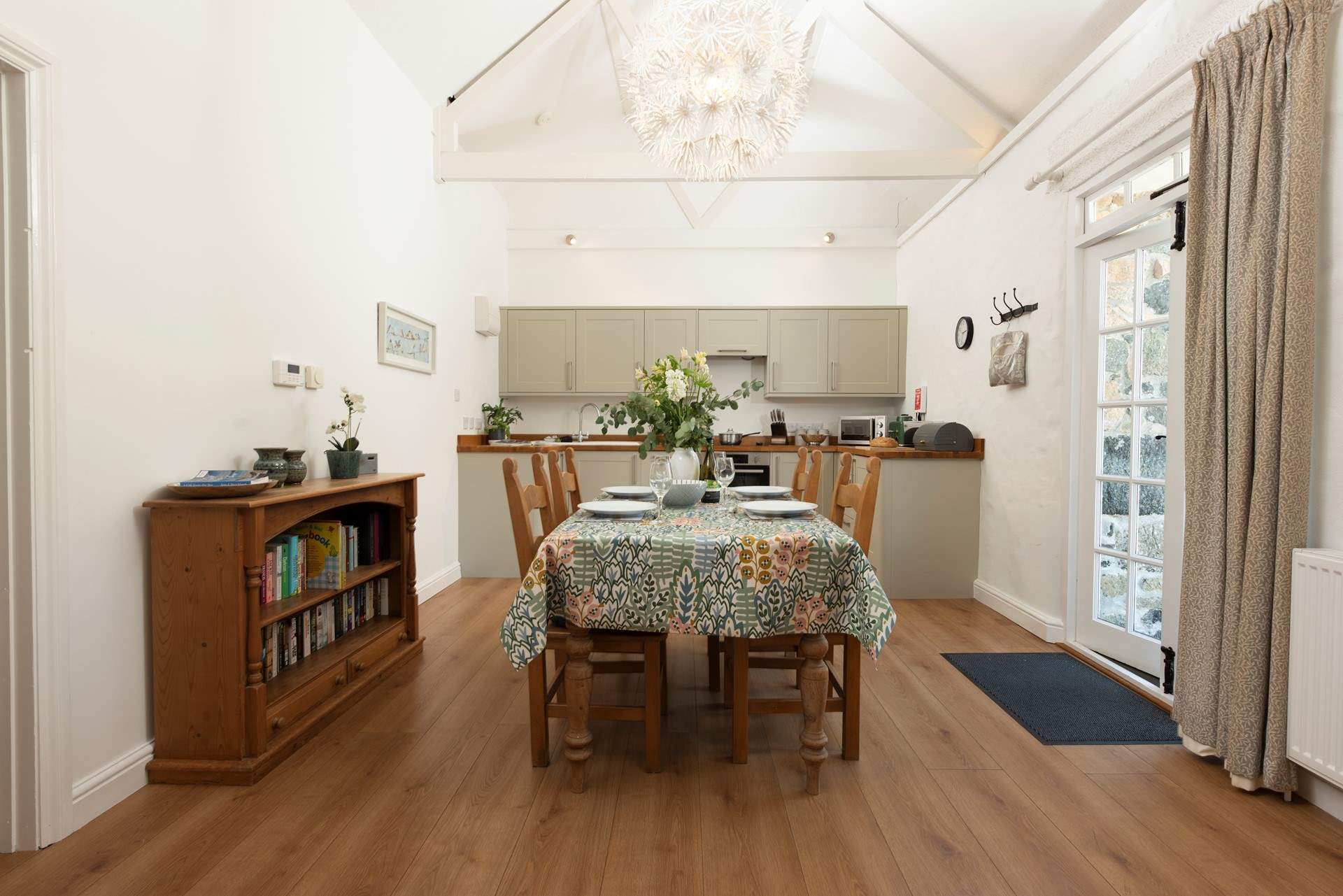 The open plan kitchen/diner has double doors to access the patio.