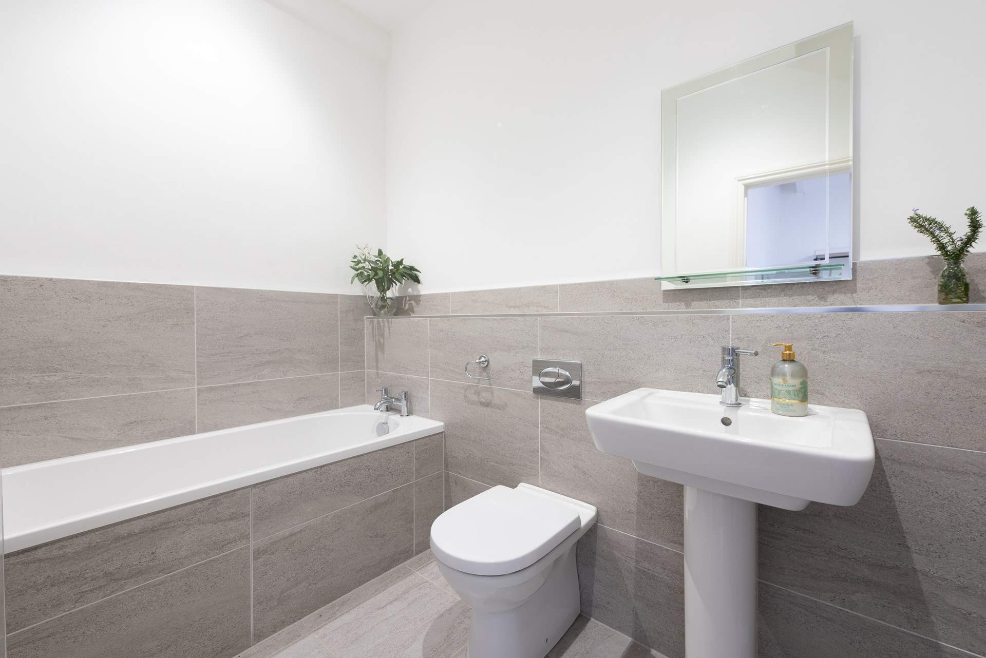 The other has a lovely bath to soak away the stresses of everyday life.