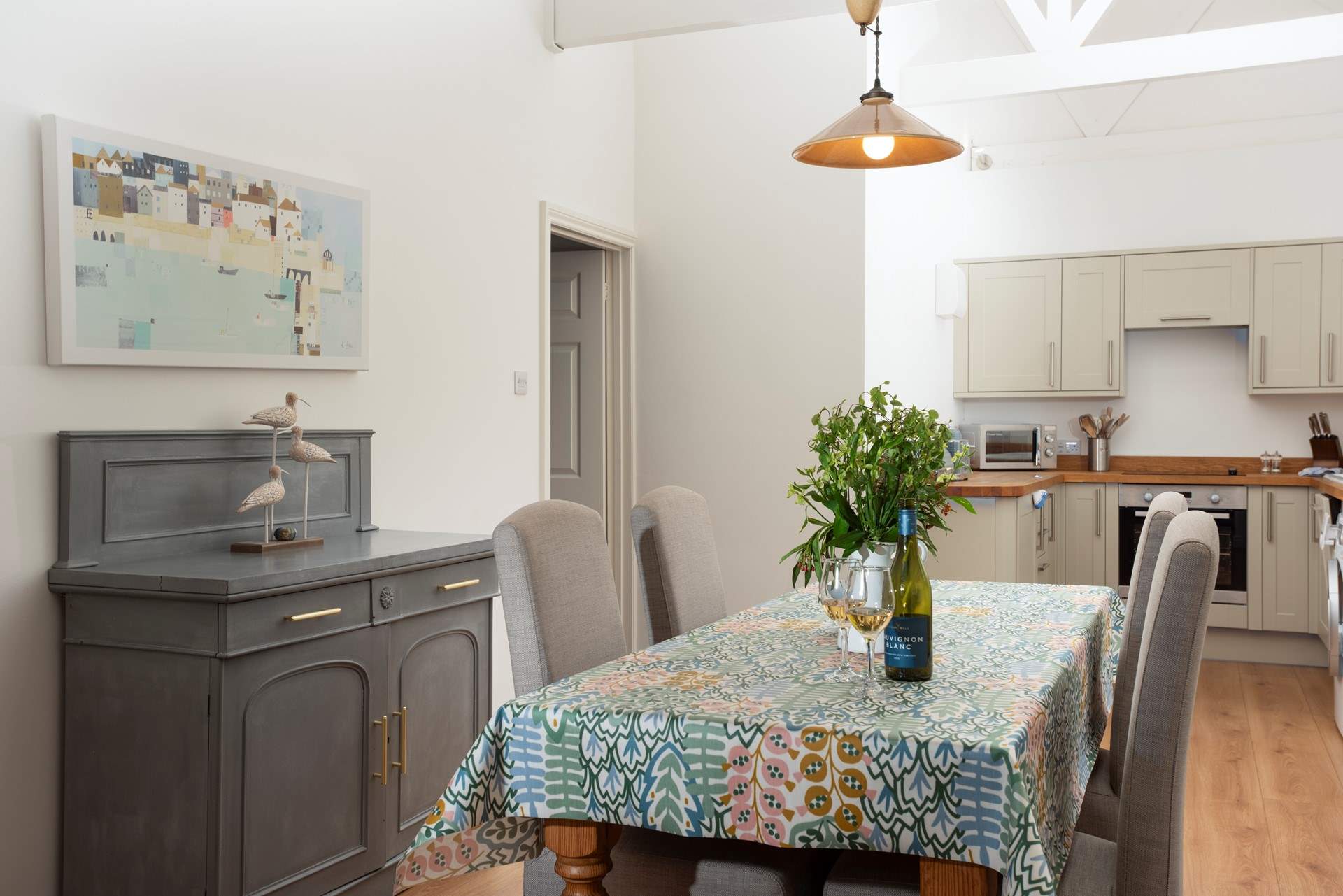 The kitchen and dining space is open plan with double doors that open to the patio.